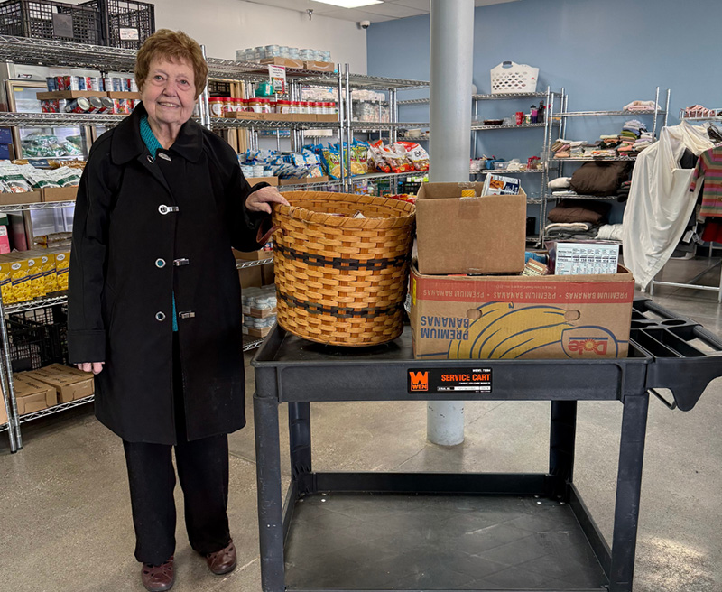 Volunteer donating her time in the food pantry