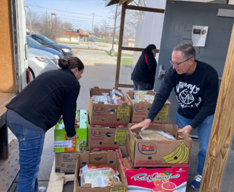 freeze out hunger volunteers packing food